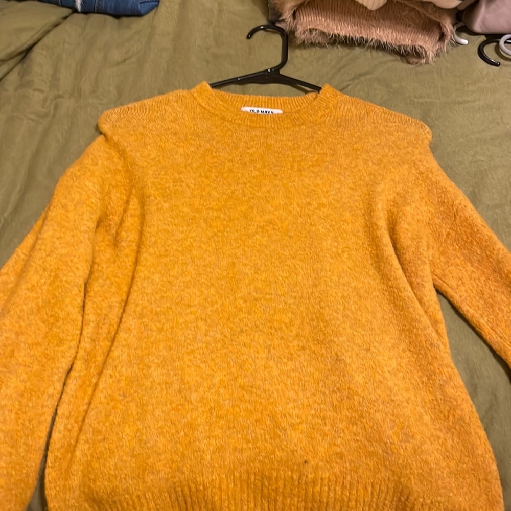 Mustard yellow sweater.